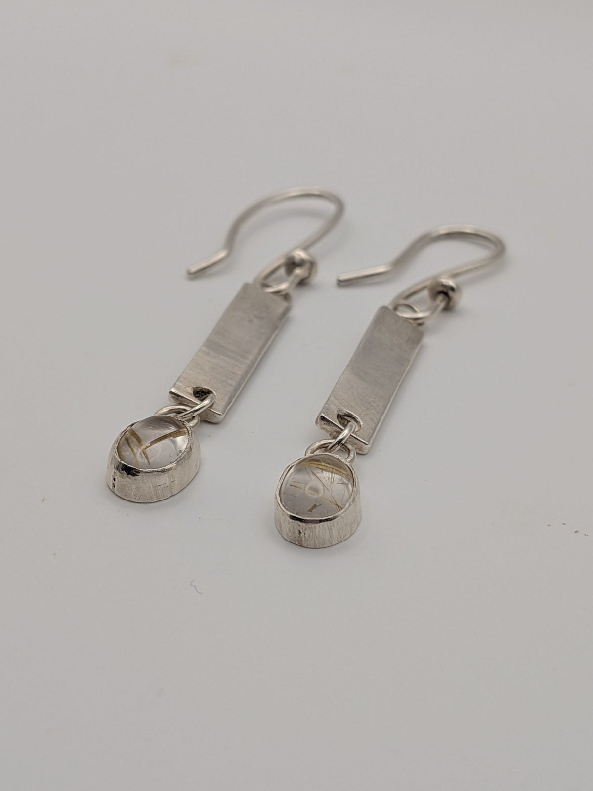 Handmade sterling silver drop earrings featuring rutilated quartz by All Our Light.