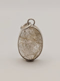 Rutilated quartz pendant in a handmade sterling silver setting by All Our Light.