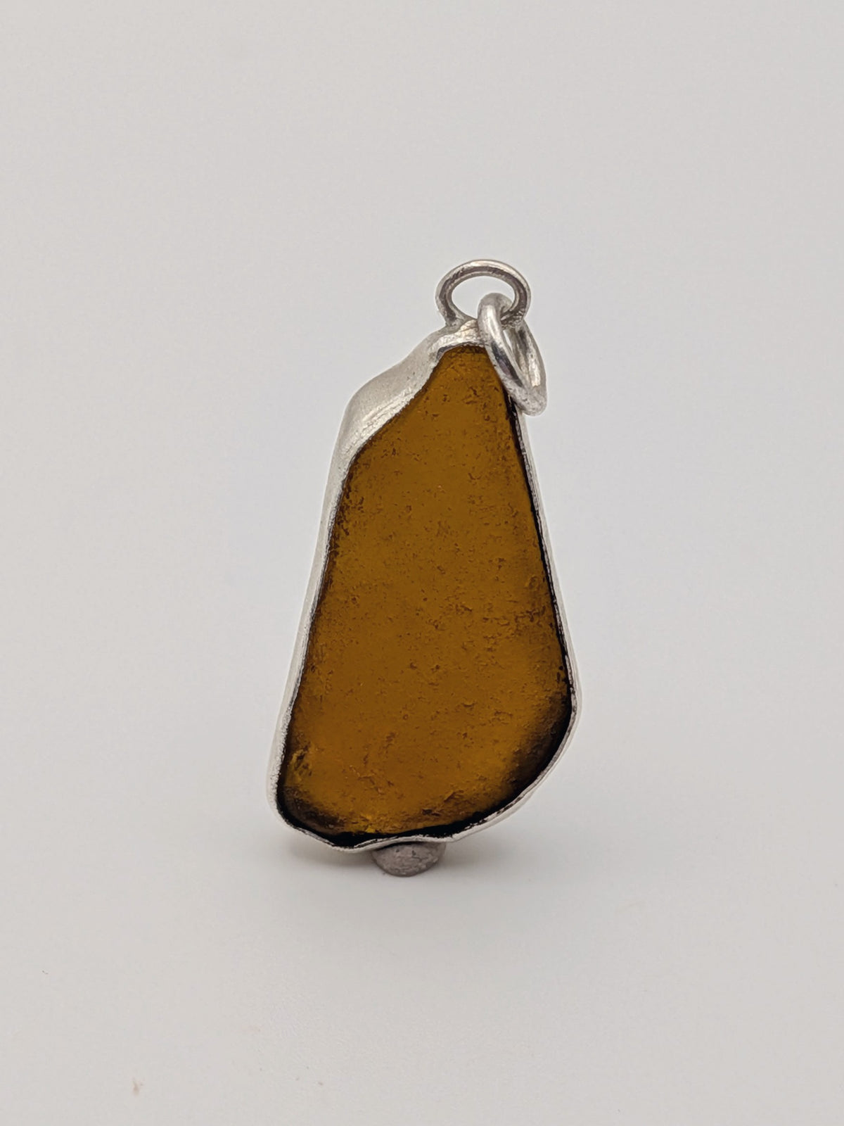 Seafoam green sea glass pendant in a handmade silver setting by All Our Light.
