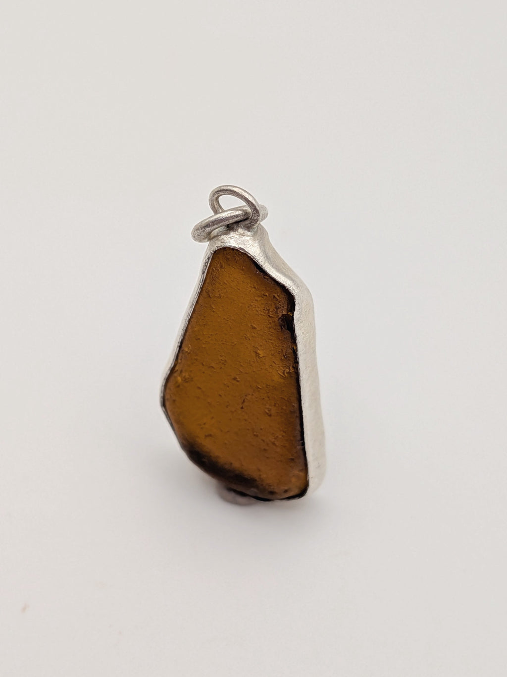 Seafoam green sea glass pendant in a handmade silver setting by All Our Light.
