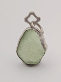 Seafoam green sea glass pendant in a handmade silver setting by All Our Light.