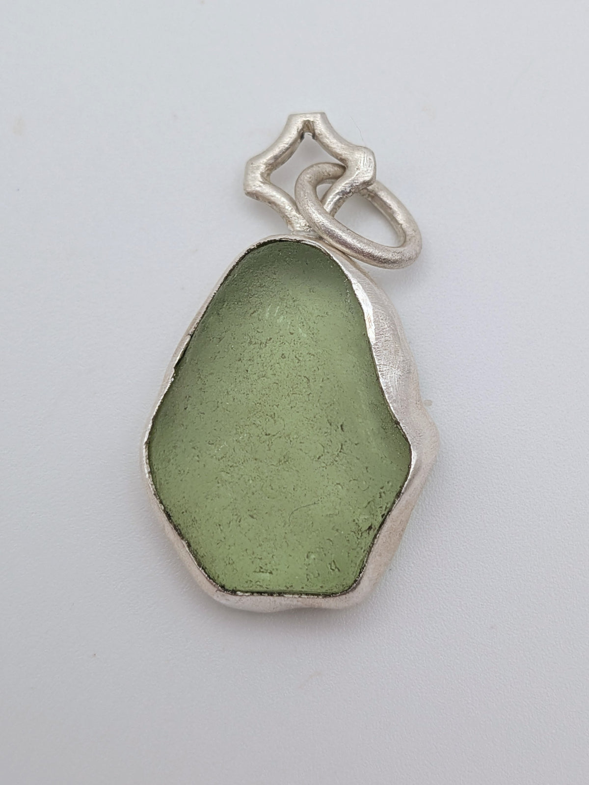 Seafoam green sea glass pendant in a handmade silver setting by All Our Light.