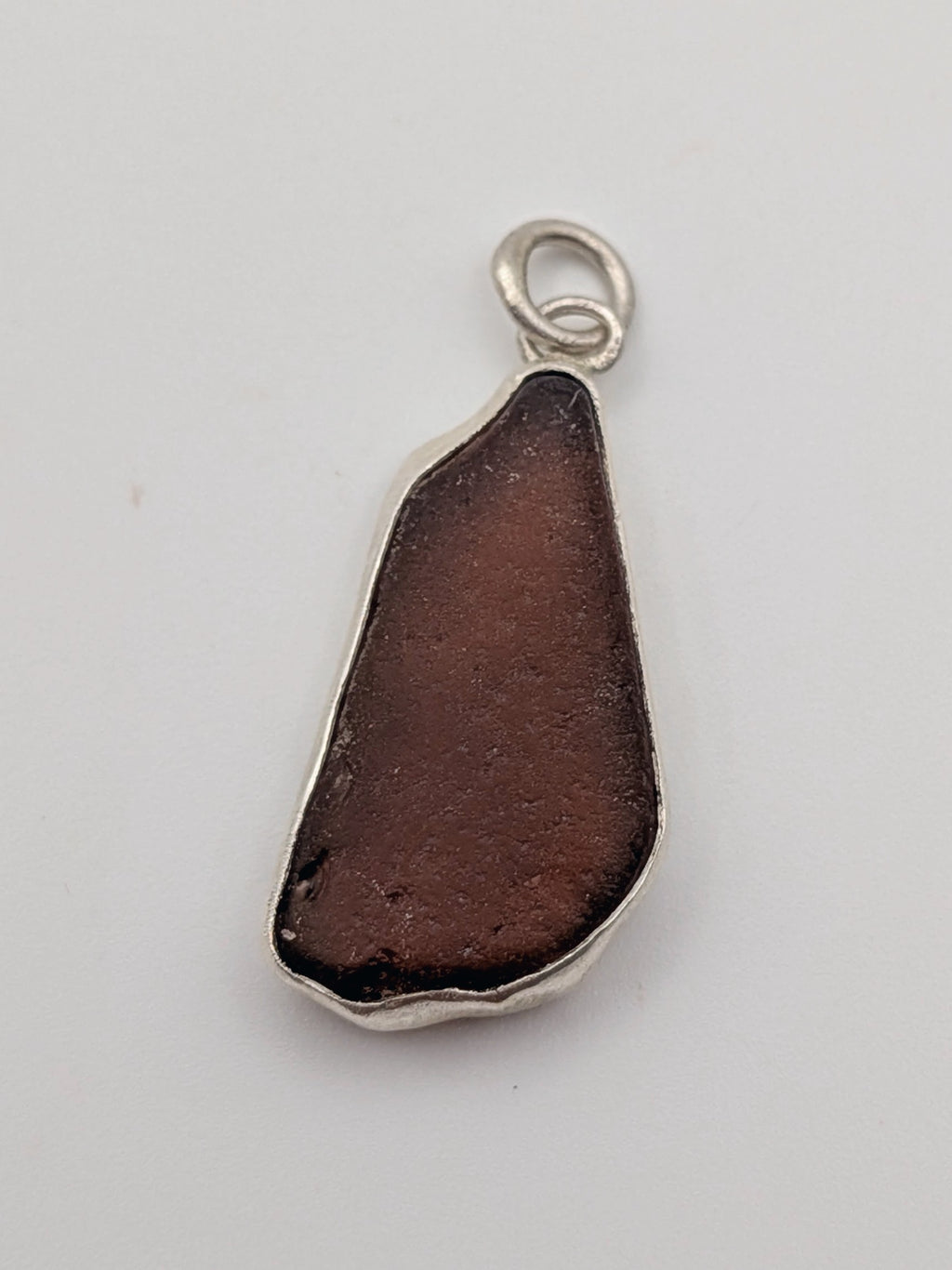 Seafoam green sea glass pendant in a handmade silver setting by All Our Light.