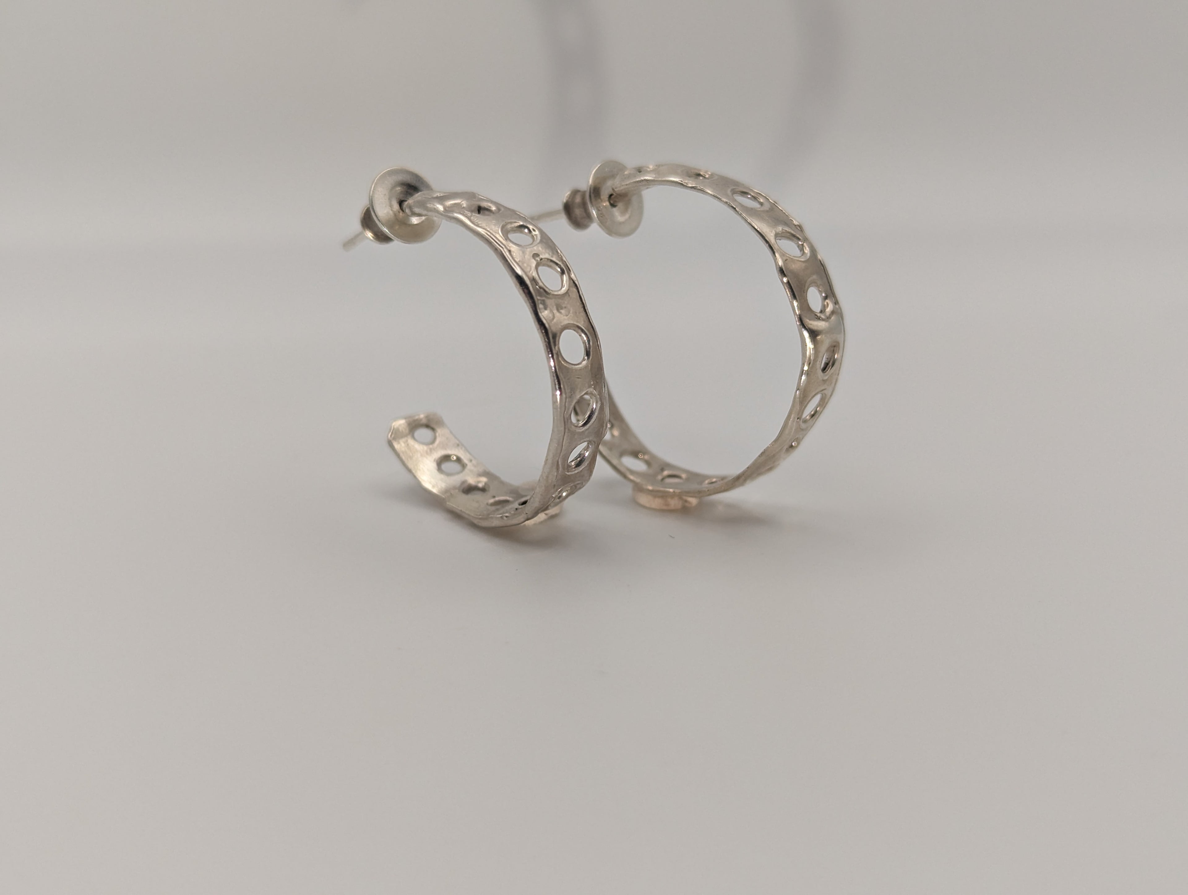 Holey Sterling silver hoop studs